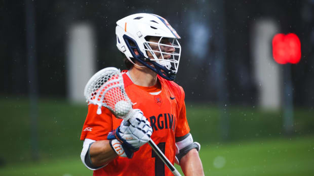 Connor Shellenberger cradles the ball during the Virginia men's lacrosse game against Duke at Klockner Stadium.